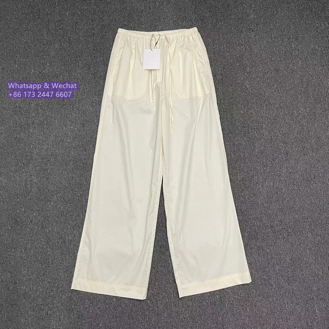 Toteme straight-leg drawstring cotton trousers elasticated waistband rear pocket black beige 2410067TT